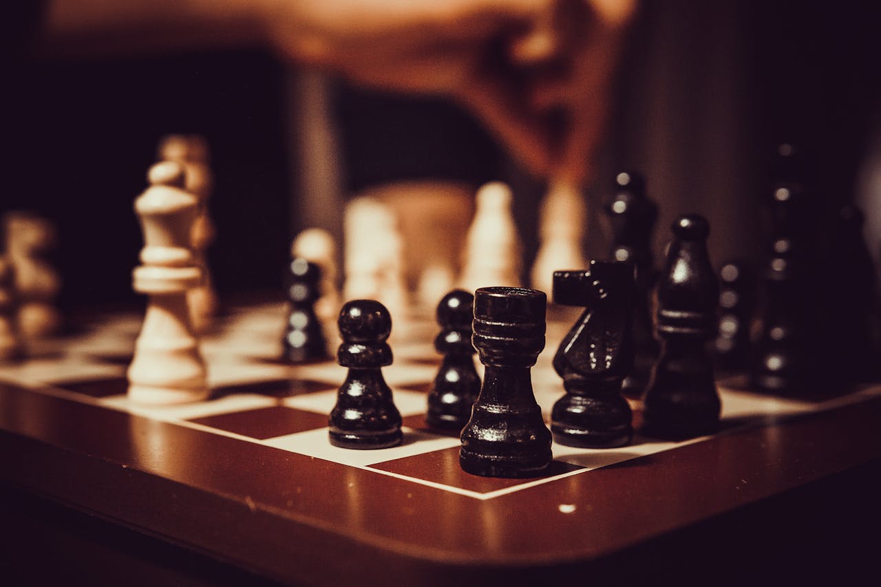 Close-up of a chessboard showcasing strategy, tactics, and focus in a competitive game.